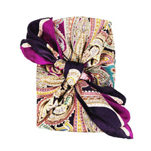 Colourful silk scarf in purple hues wrapped around a College Green gift box tied in a bow