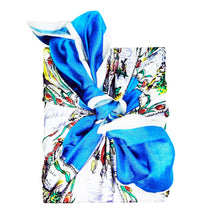 Colourful vintage style silk scarf wrapped around a College Green gift box tied in a bow