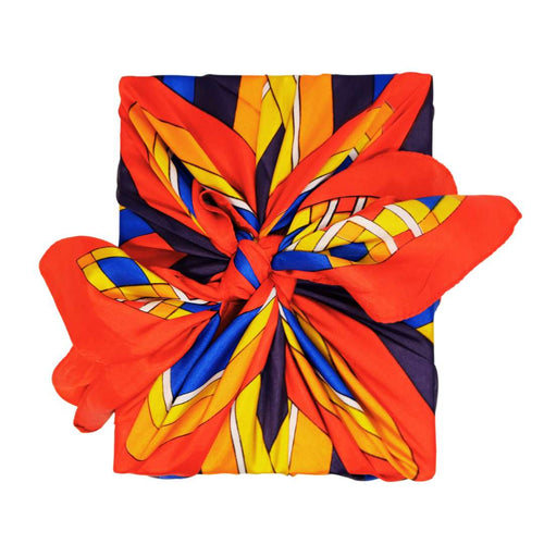 Colourful silk scarf wrapped around a College Green gift box tied in a bow