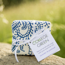 A wrapped bar of soap with label that says: College Green. Natural handmade soap with pure essential oils. Lavender & patchouli